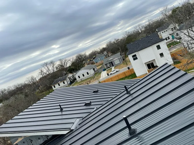 Standing seam metal roof panels with vents for Skylight Repair in Slaton